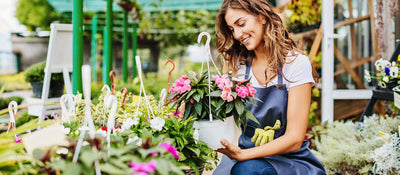 A Bloombox employee hand-picks the perfect hanging basket